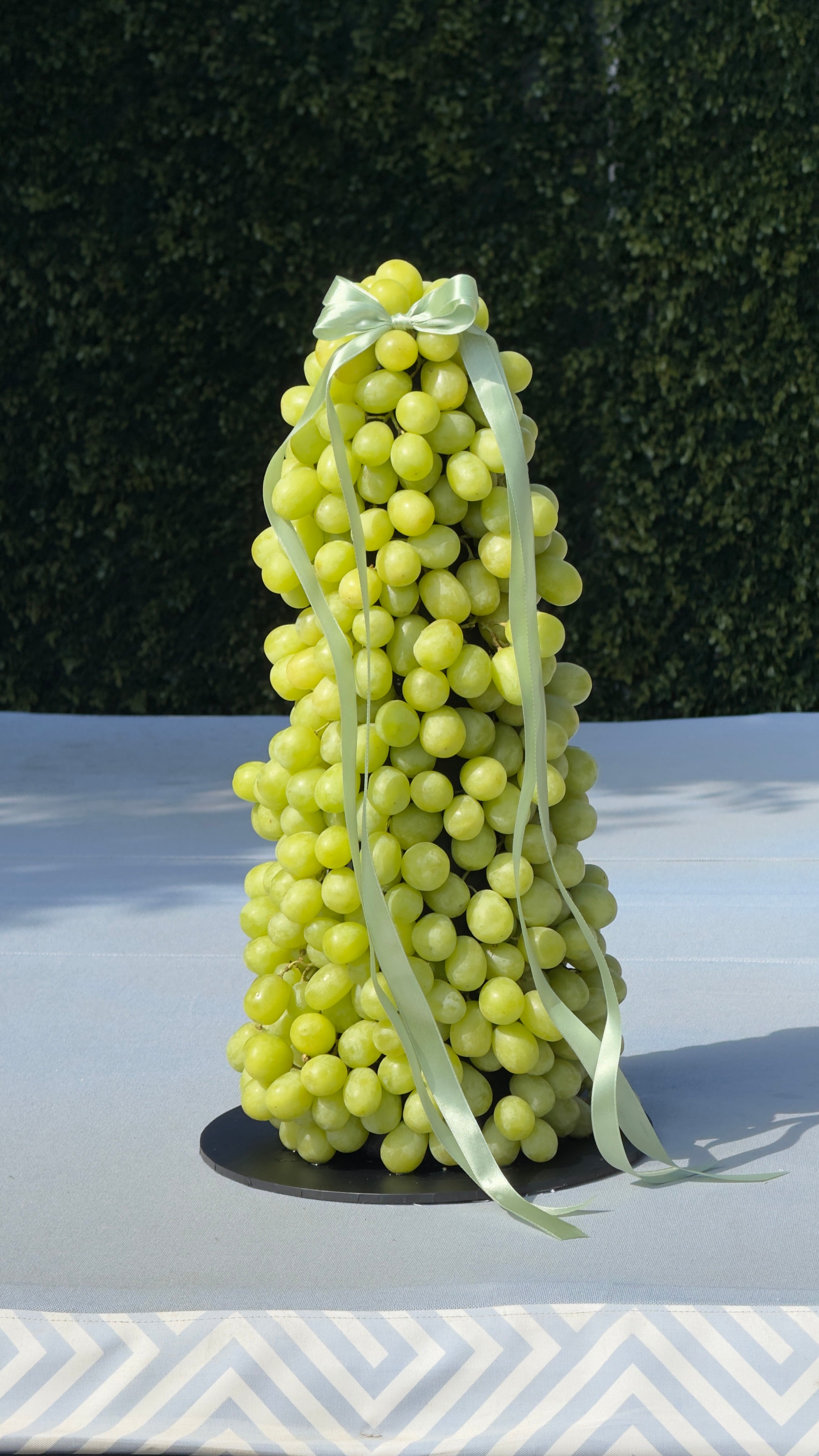 Healthy grape tower display for birthdays and corporate events