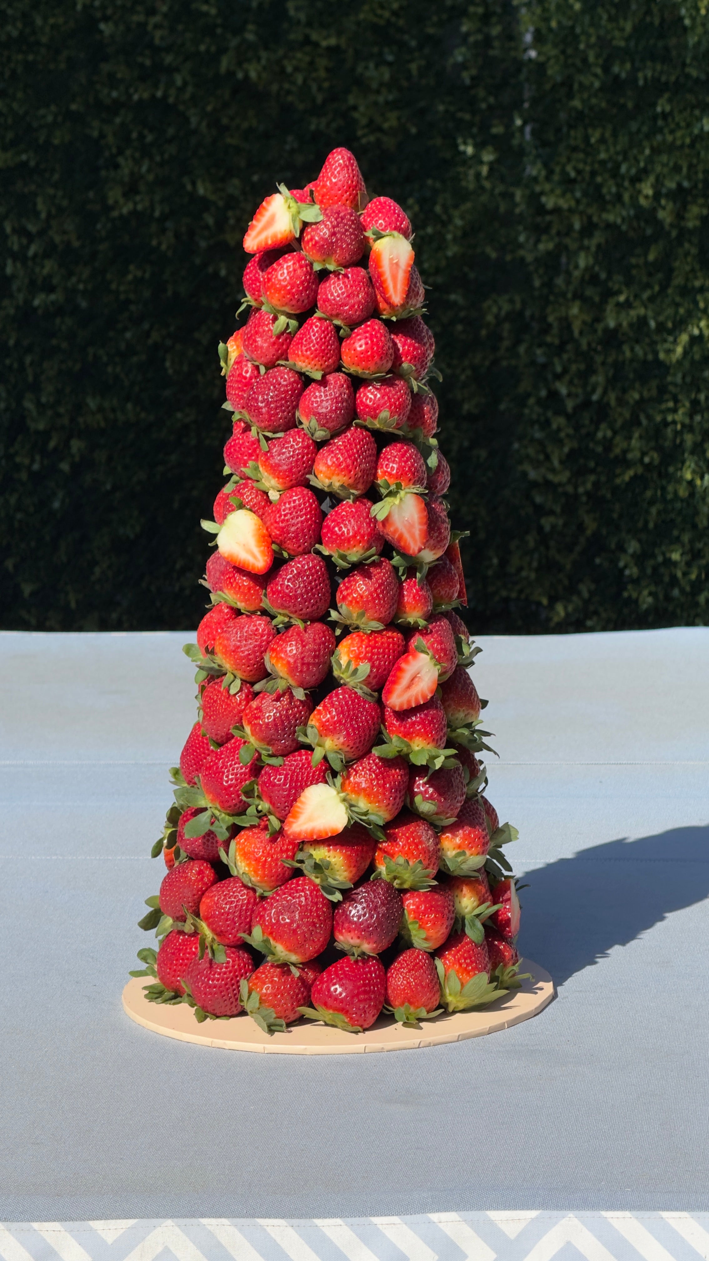 Plain strawberry fruit tower displayed on a dessert table