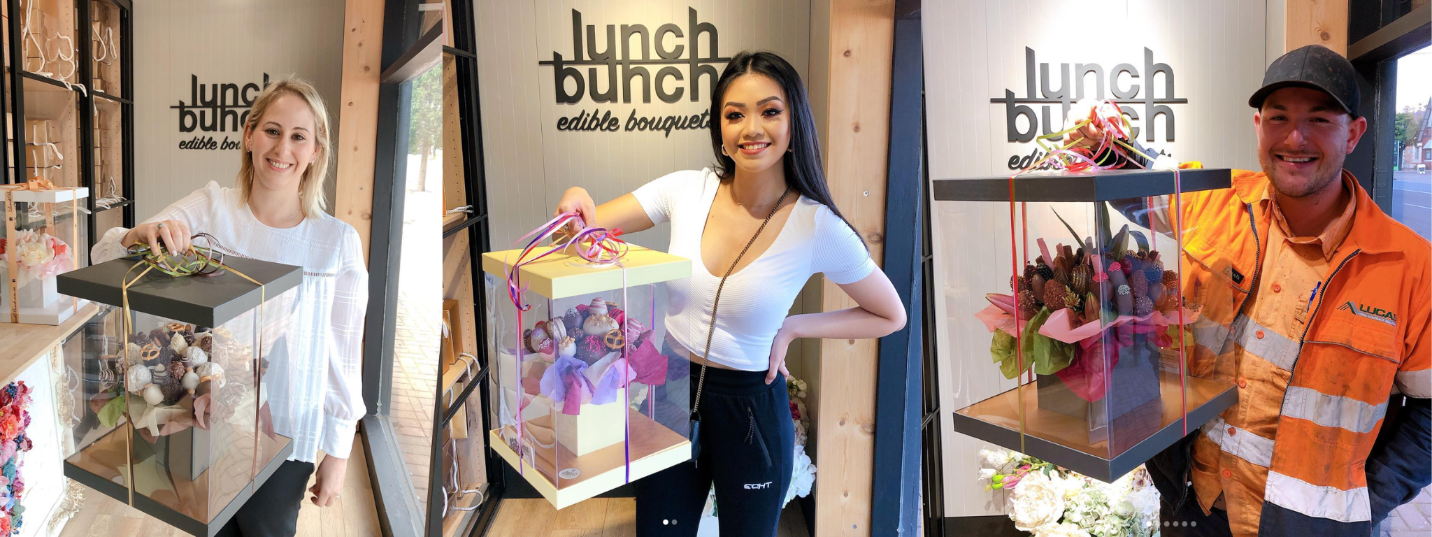 Three people holding gift boxes with 'lunch bunch' branding in a store setting.