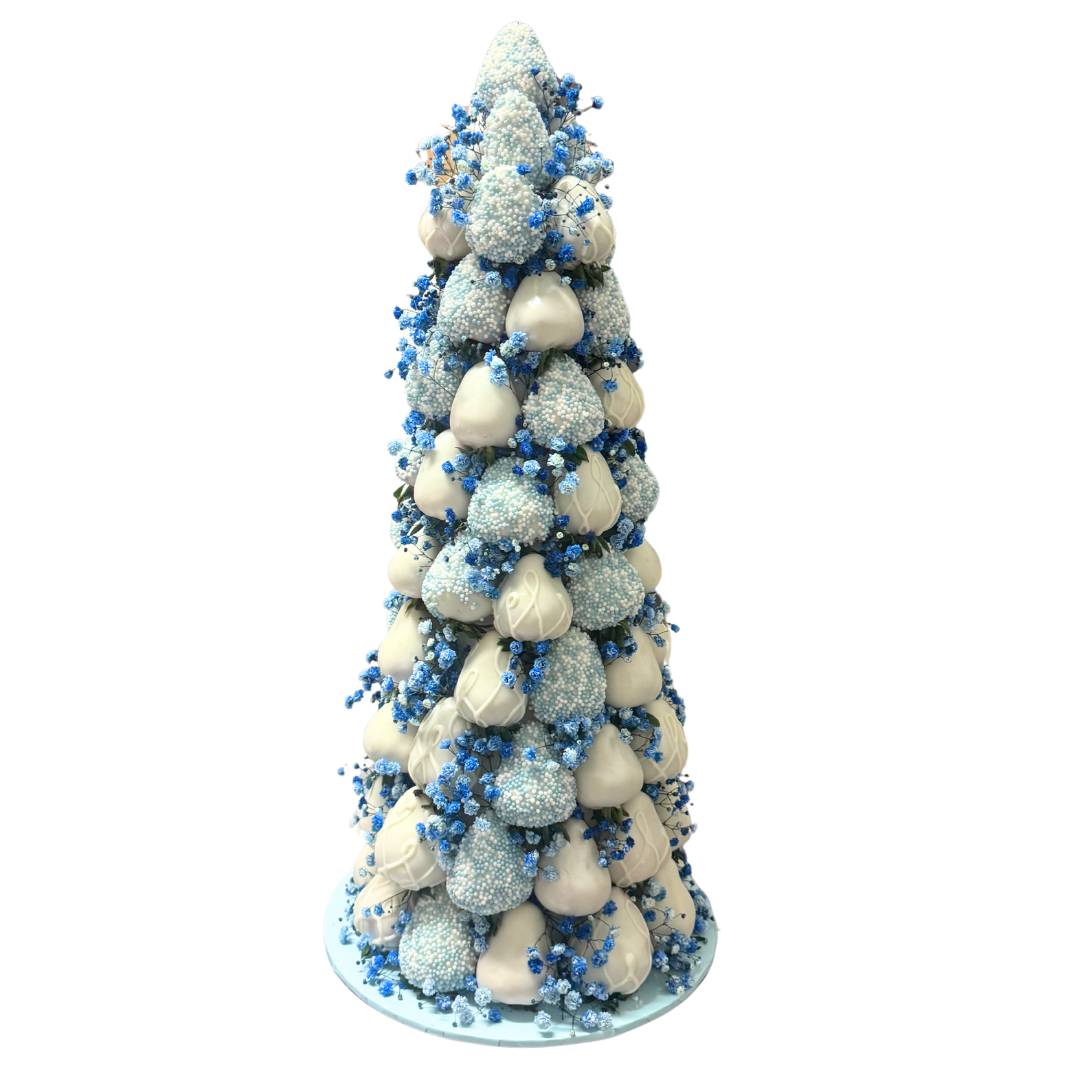 Blue chocolate strawberries with decorative flowers for baby shower dessert table