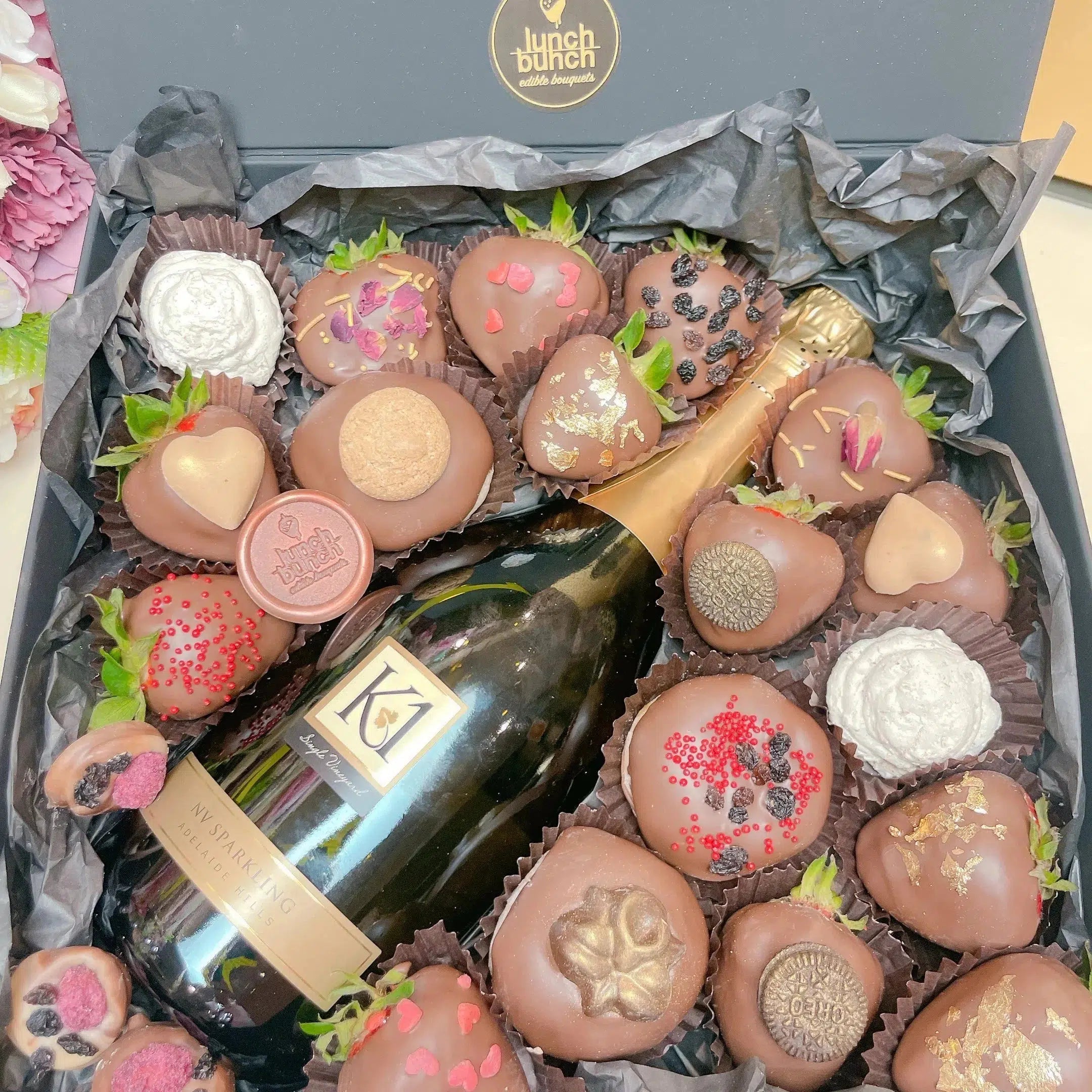 Order the perfect gift for your special one with our exquisite Hamper Box. Our extraordinary selection of the finest local strawberries, freshly baked donuts and the iconic 750ml bottle of Sparkling K1 NV Bottle by Geoff Hardy vineyard make this Hamper Box the perfect gift to surprise your special someone. Get your Hamper Box with Same-Day Delivery in Adelaide