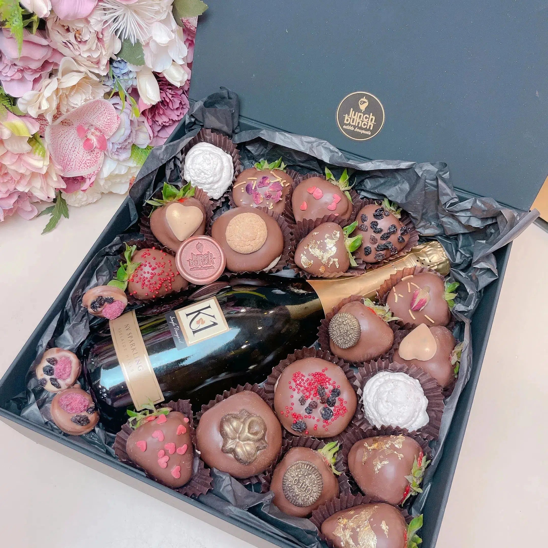 Get your Hamper Box with Same-Day Delivery in Adelaide, Surprise your special someone on Valentine's Day with our exquisite Hamper Box. Our extraordinary selection of the finest local strawberries, freshly baked donuts and the iconic 750ml bottle of Sparkling K1 NV Bottle