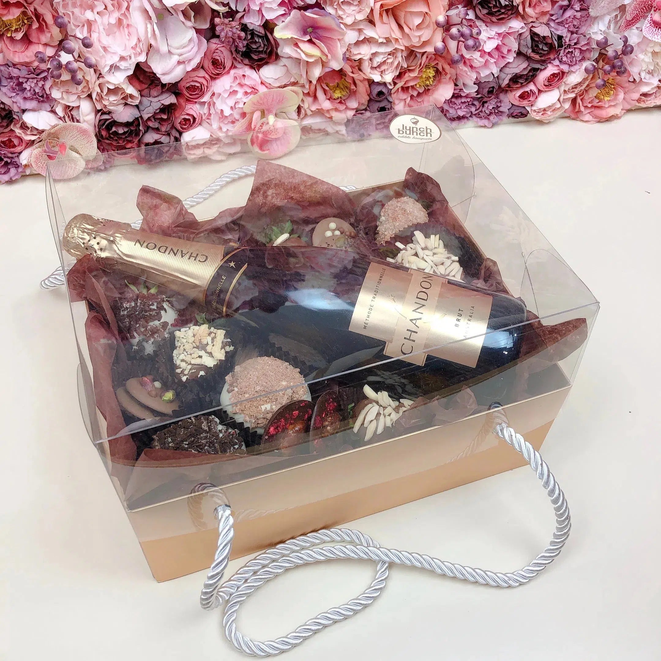 Mini doughnuts, chocolate covered strawberries and champagne hamper