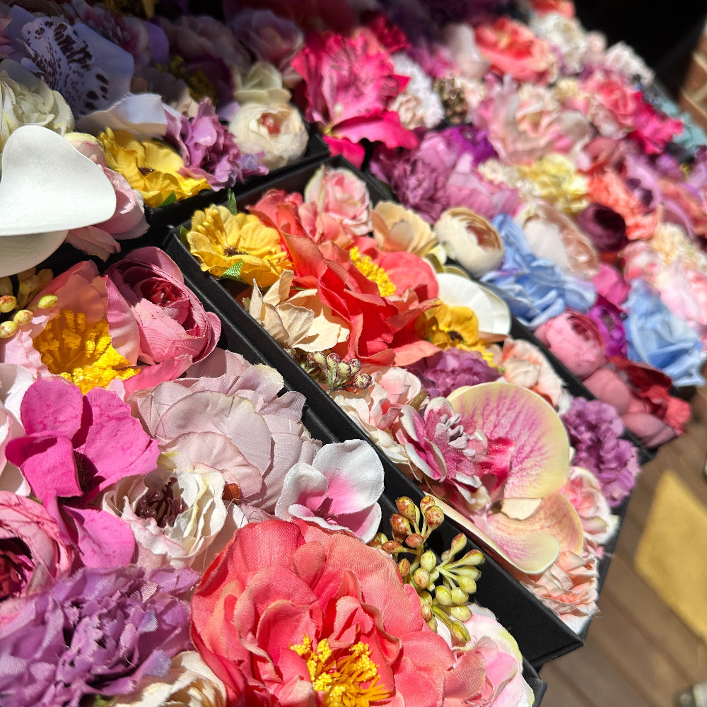 Colourful silk flower arrangement in a keepsake gift box