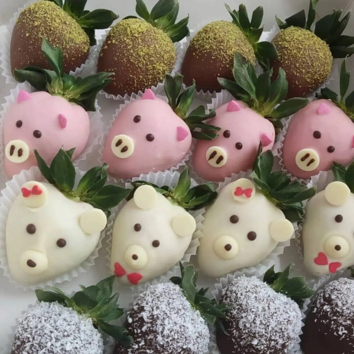 Chocolate-covered strawberries decorated as colourful animals during a kids edible decorating workshop