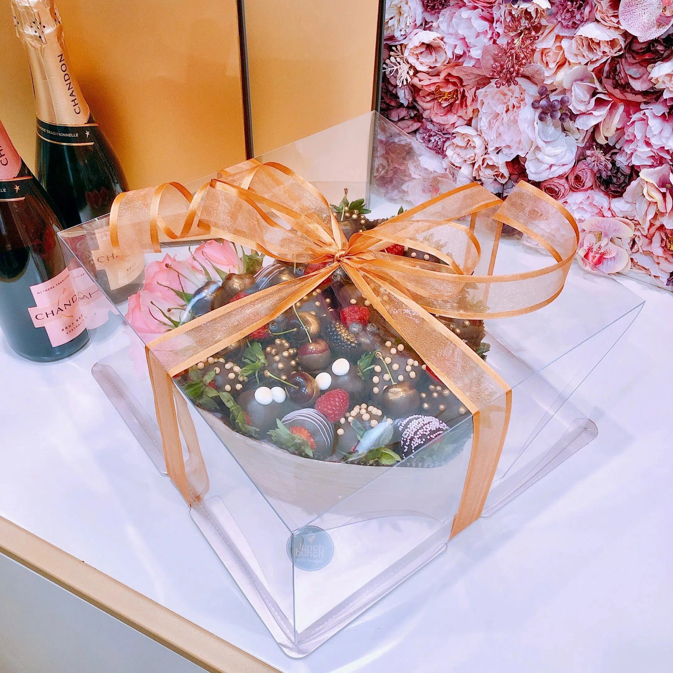 Valentine's Day strawberries and macaroons in love heart gift box with chocolate covered strawberries