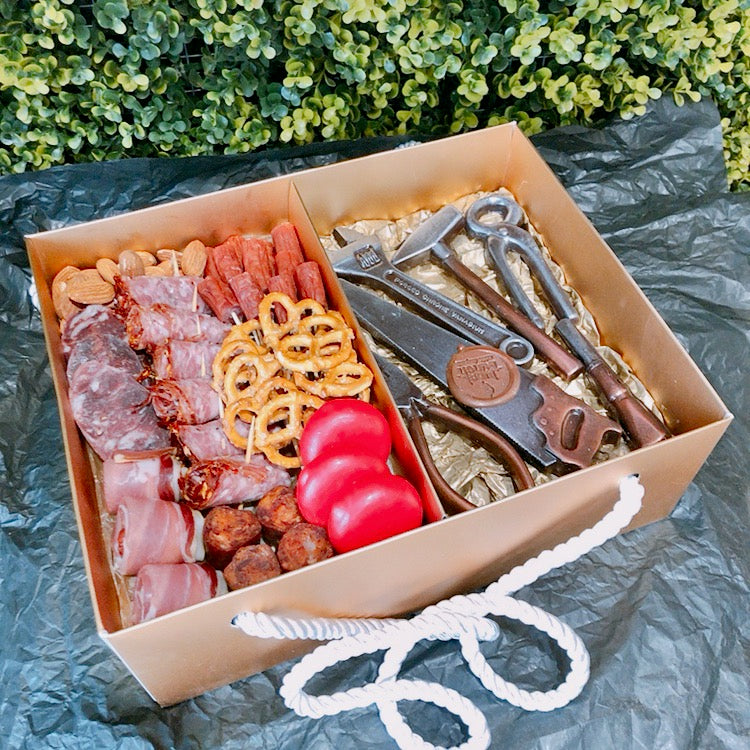 Meat and cheese hamper with chocolate tools made of dark vegan chocolate for a handyman