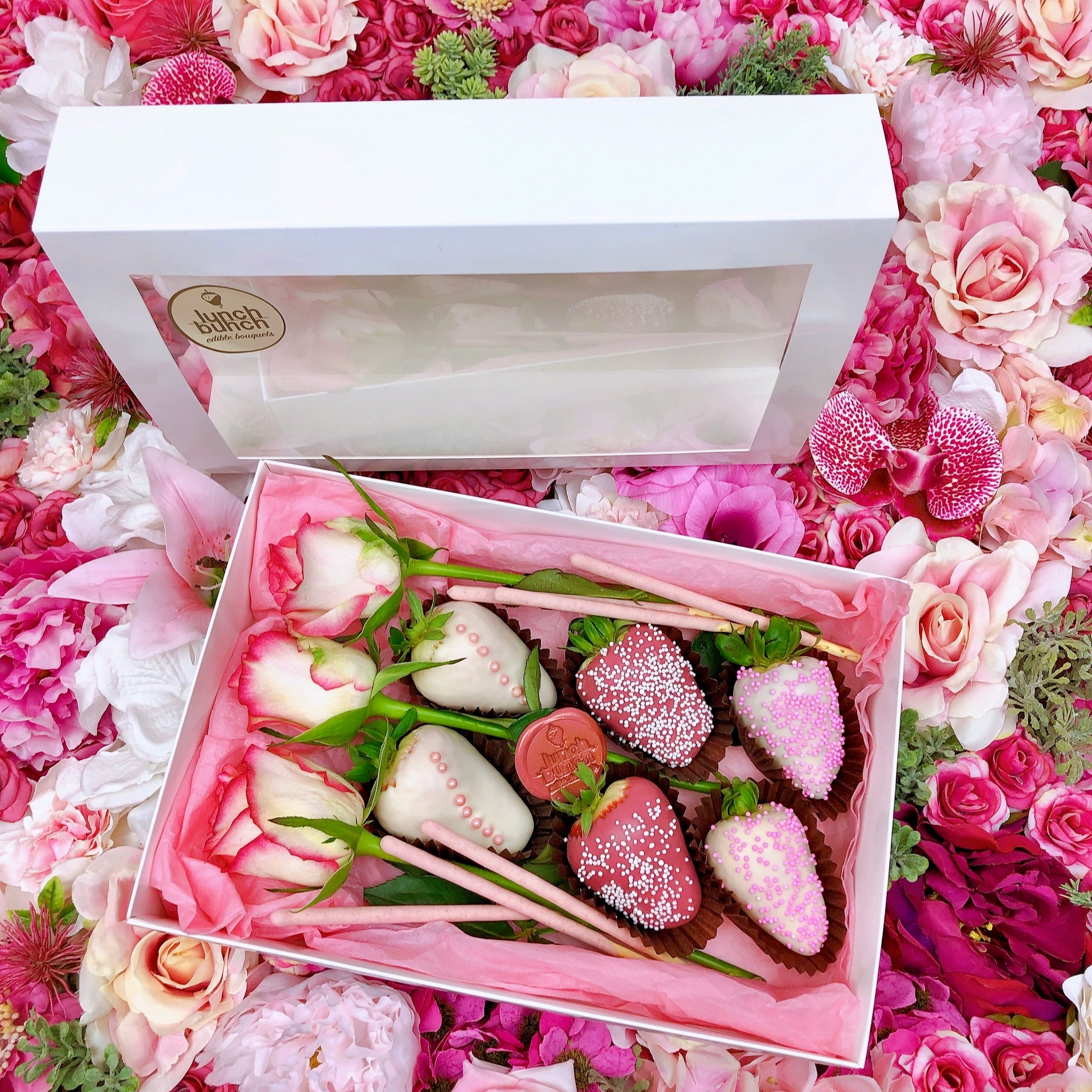 Small gift box with chocolate covered strawberries and roses perfect for him and for her
