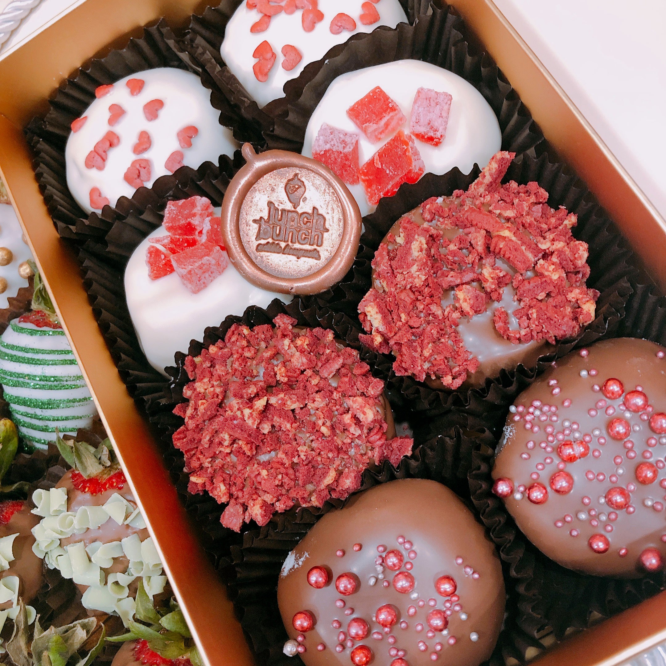 Chocolate strawberries and doughnuts hamper box, sweet treat strawberries with toppings and doughnuts