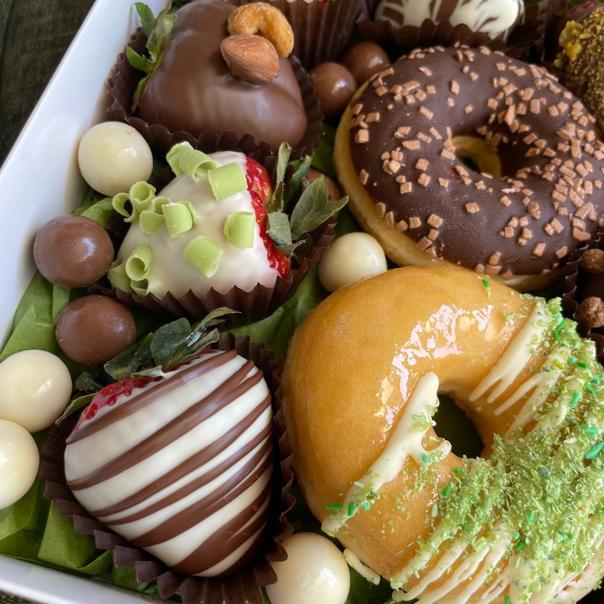 Delight in heavenly donuts & chocolate-covered strawberries. Perfect for any occasion!