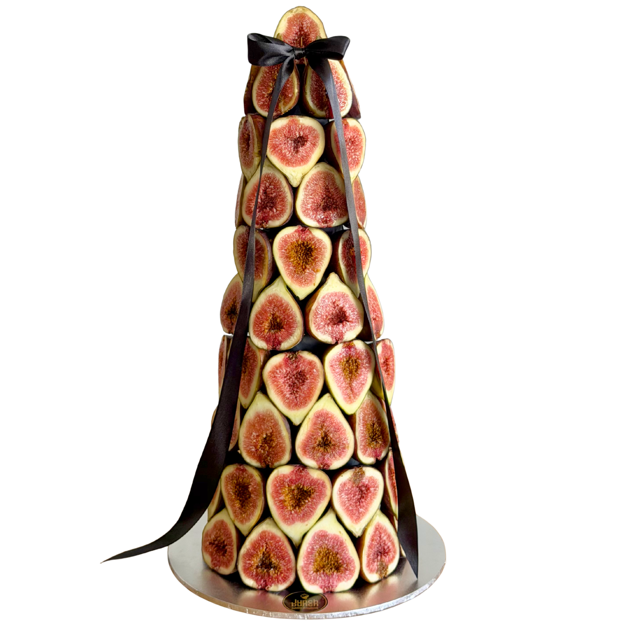 Fresh fig tower centrepiece made with stacked seasonal figs and black ribbon, elegant edible display for events in Melbourne and Adelaide.