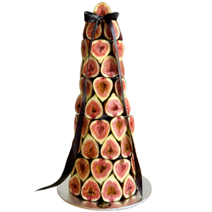 Fresh fig tower centrepiece made with stacked seasonal figs and black ribbon, elegant edible display for events in Melbourne and Adelaide.