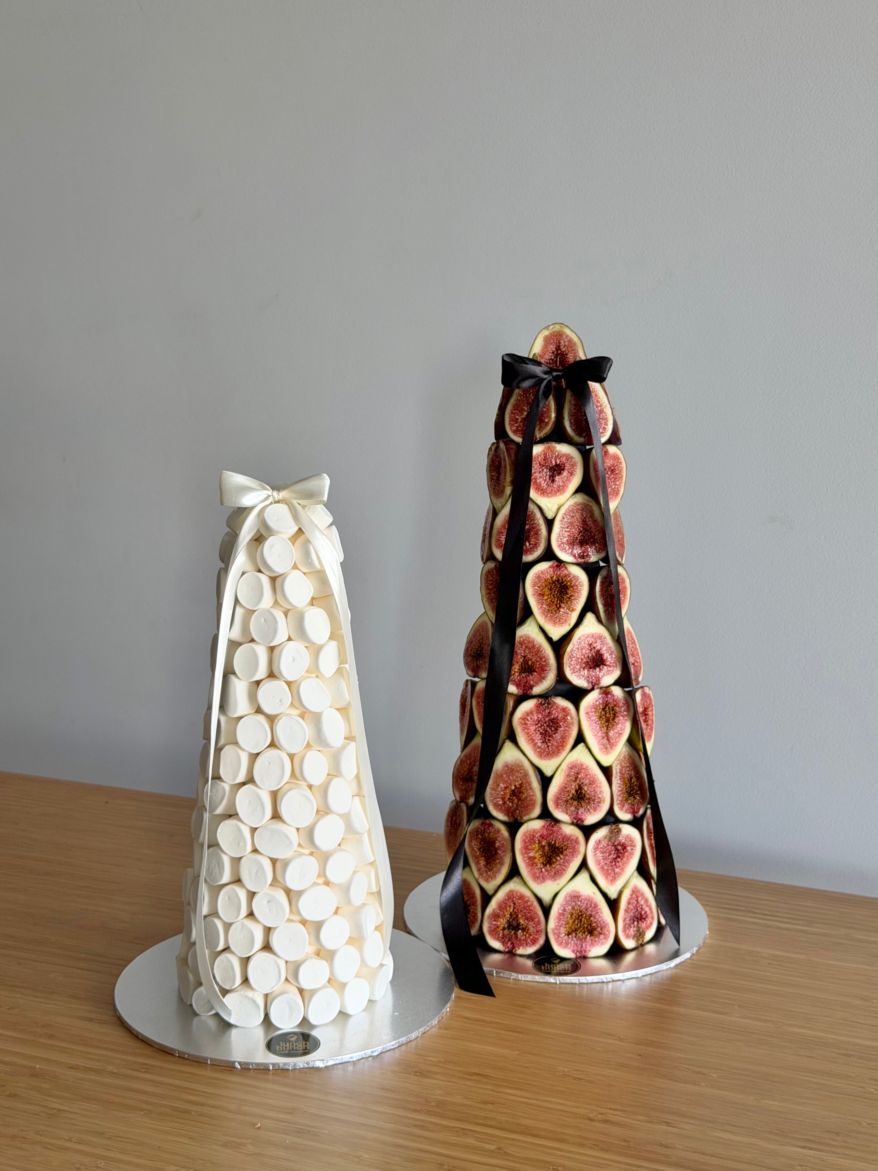 Fresh fig tower beside white marshmallow tower, edible dessert centrepieces for weddings and events.