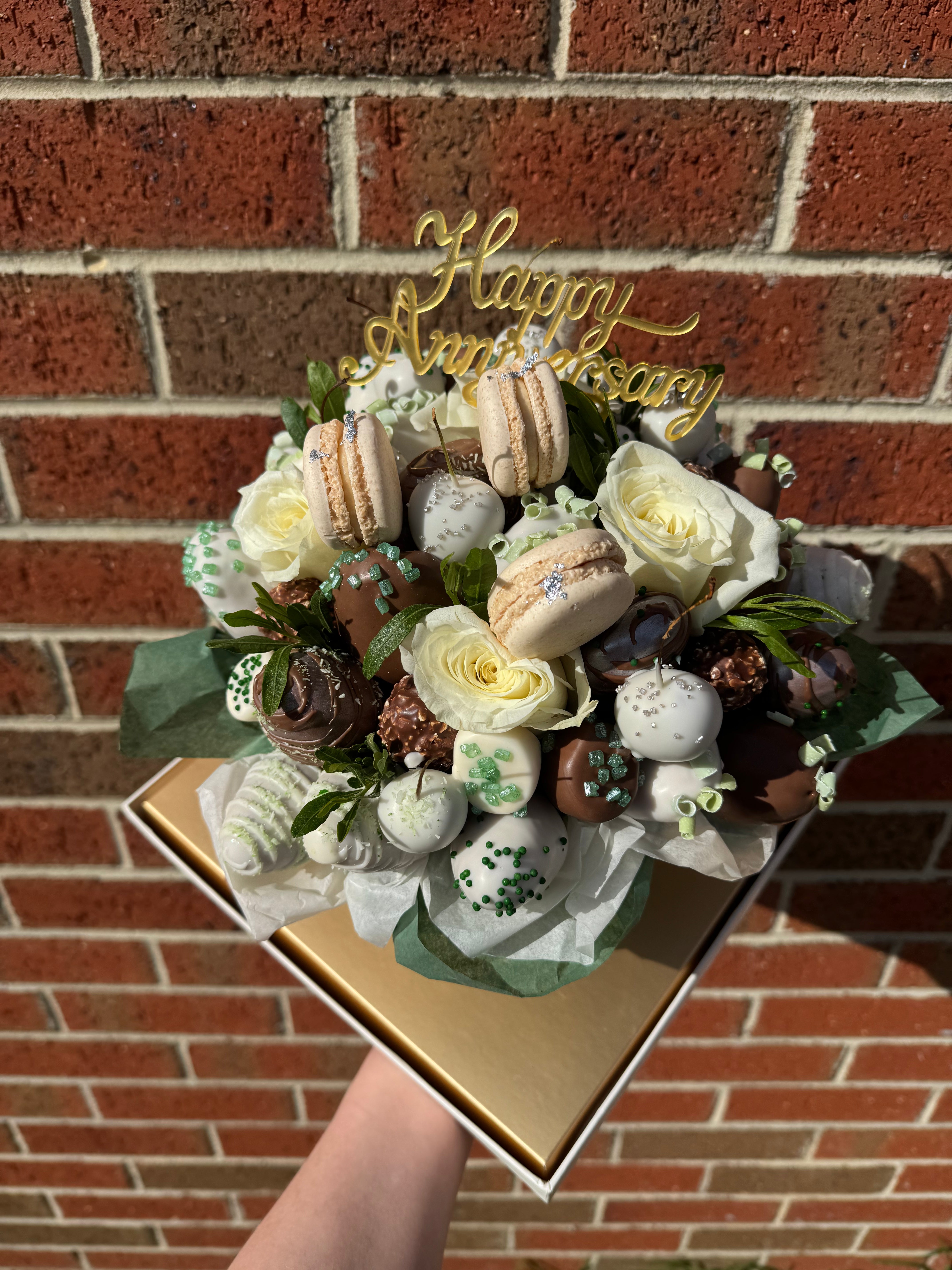 Hand-decorated strawberries covered in premium chocolate with Ferrero Rocher chocolates and berries