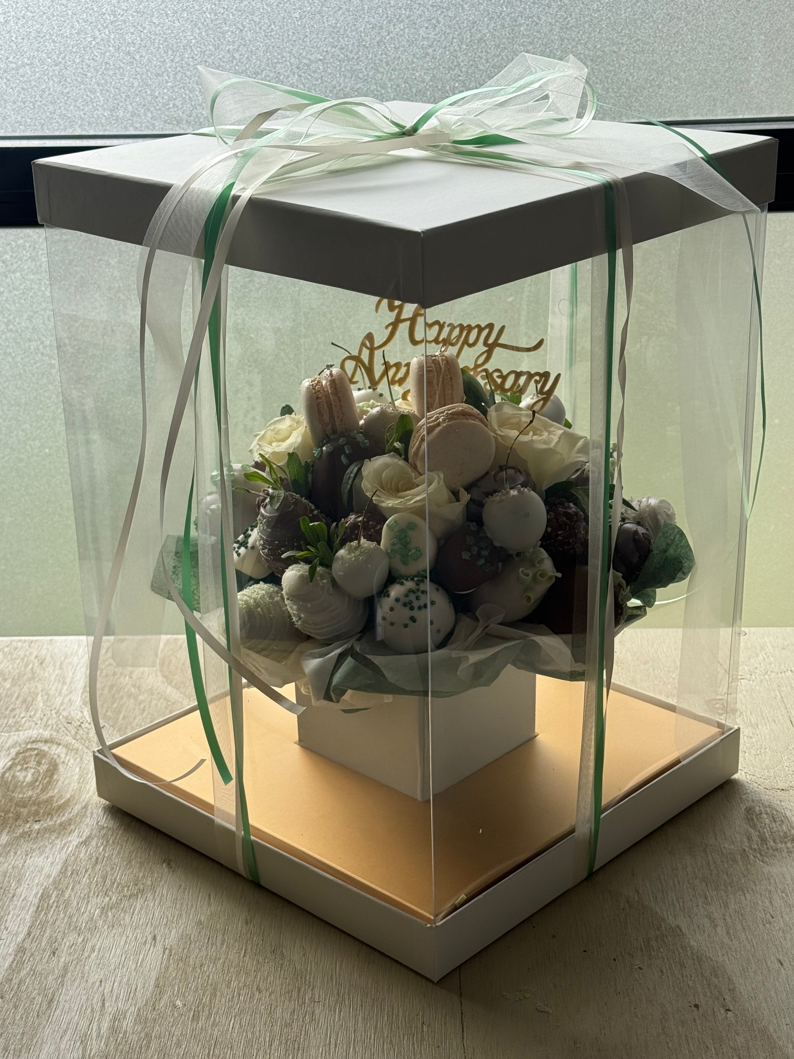 Romantic emerald chocolate strawberry bouquet displayed in signature Aquarium Box