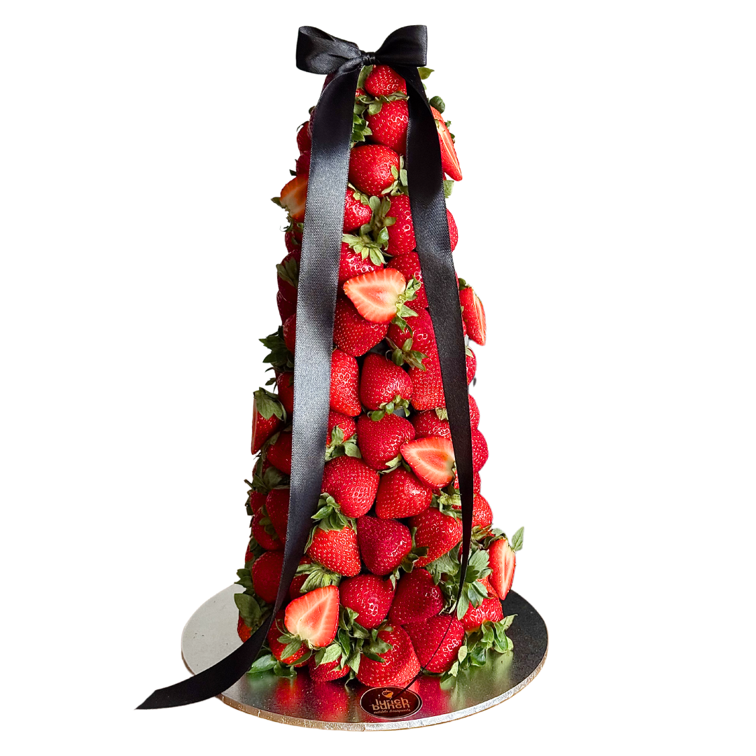 Strawberry tower with a black ribbon on a white background