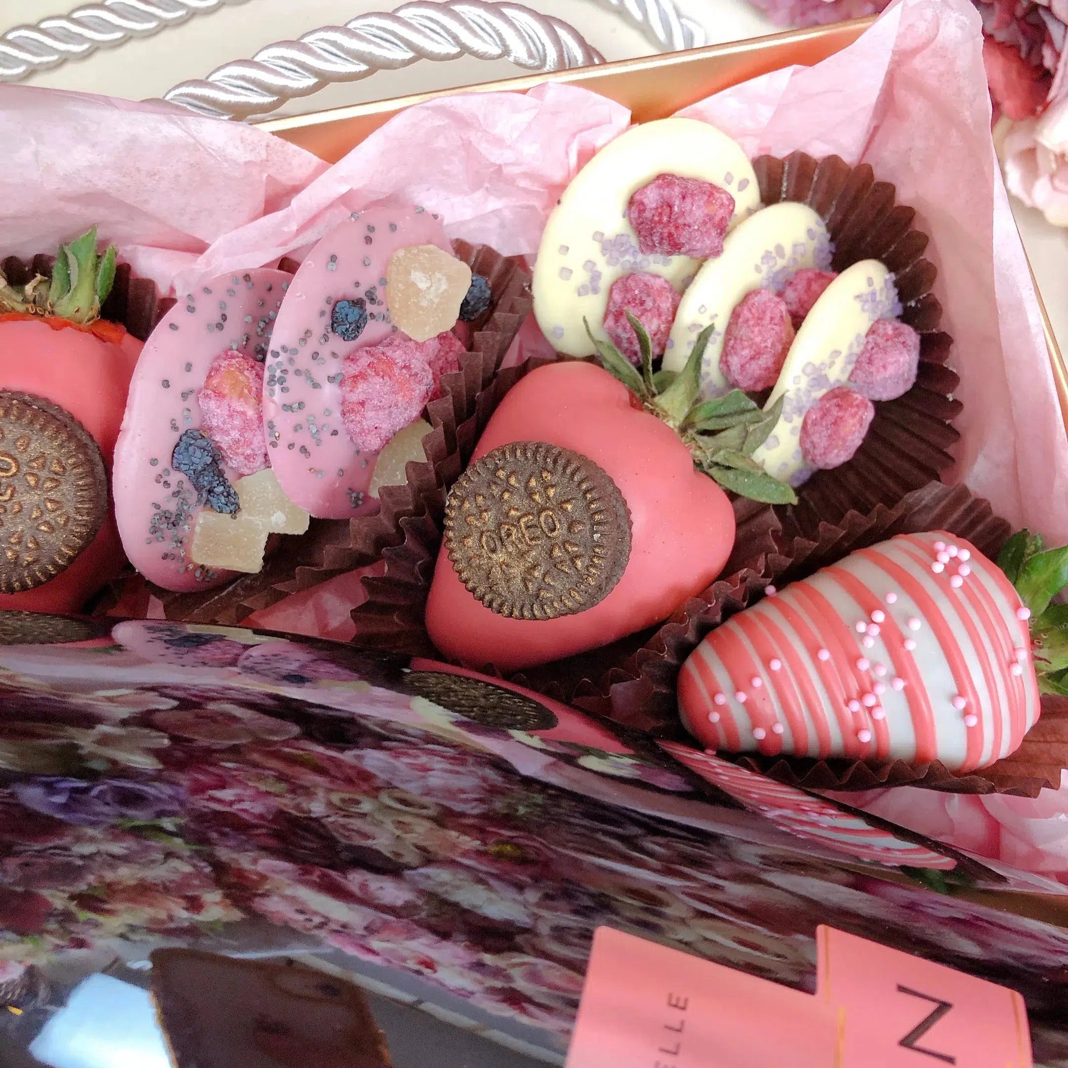 Gourmet hamper full of chocolate covered strawberries and mini doughnuts