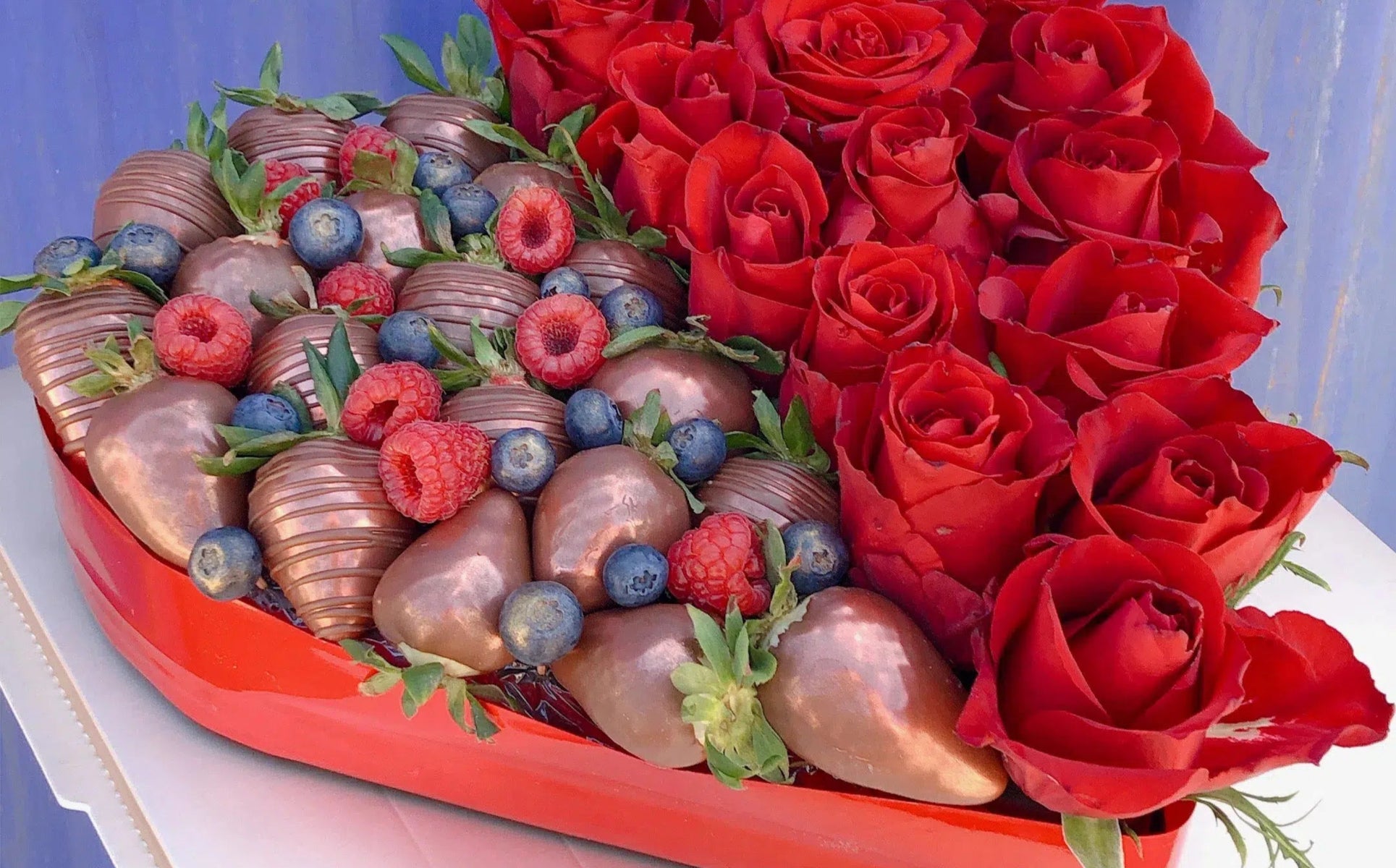 fresh strawberry covered in chocolate in love heart box with roses, heart shape flower box gift Valentine’s Day Chocolate