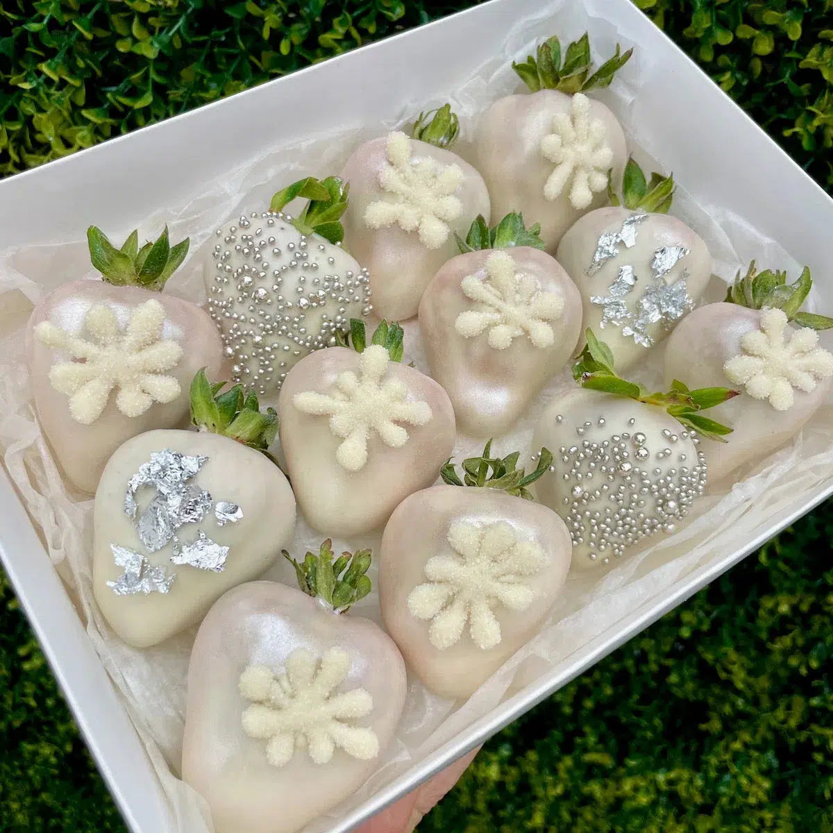 Add a touch of festive magic to your celebrations with our Christmas-Themed Strawberries Covered in White Chocolate. Each strawberry is elegantly dipped in creamy white chocolate and decorated with festive designs, creating a delightful blend of holiday cheer and indulgent sweetness. Perfect for spreading joy at holiday gatherings or as a special gift, these strawberries are a luxurious treat that embodies the spirit of Christmas. Available for delivery to Adelaide and Melbourne, they’re a delicious way to 