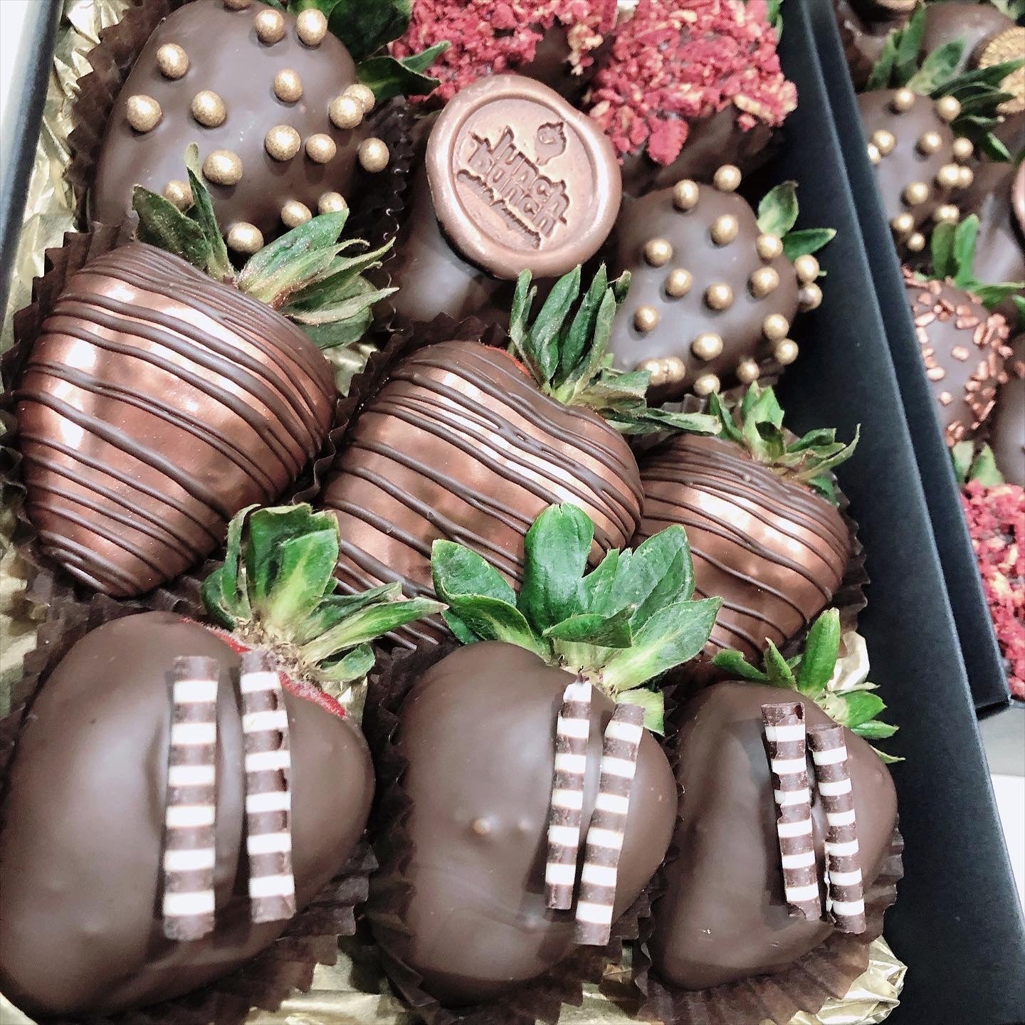 Small box of chocolate covered strawberries in dark vegan chocolate