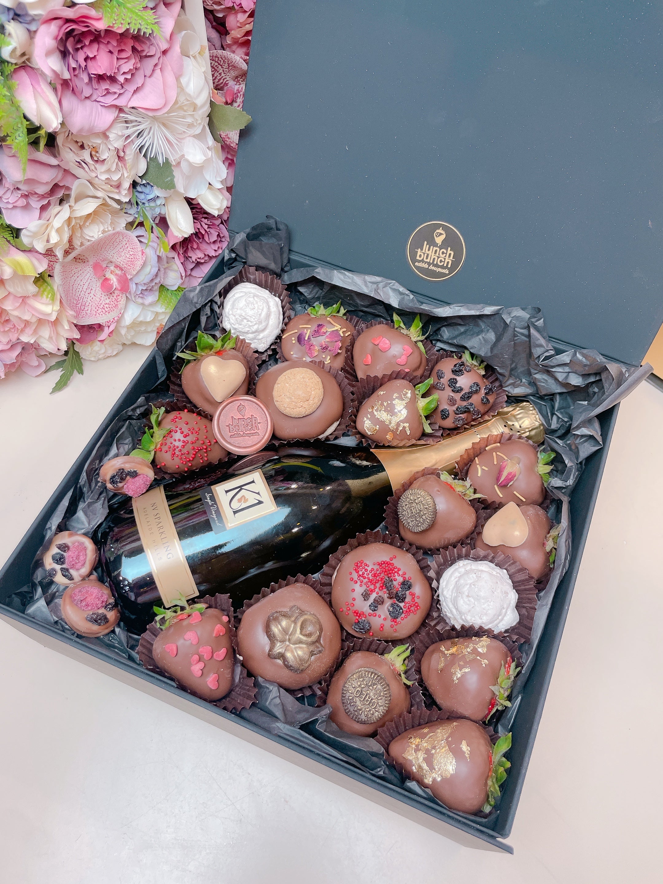 Get your Hamper Box with Same-Day Delivery in Adelaide, Surprise your special someone on Valentine's Day with our exquisite Hamper Box. Our extraordinary selection of the finest local strawberries, freshly baked donuts and the iconic 750ml bottle of Sparkling K1 NV Bottle