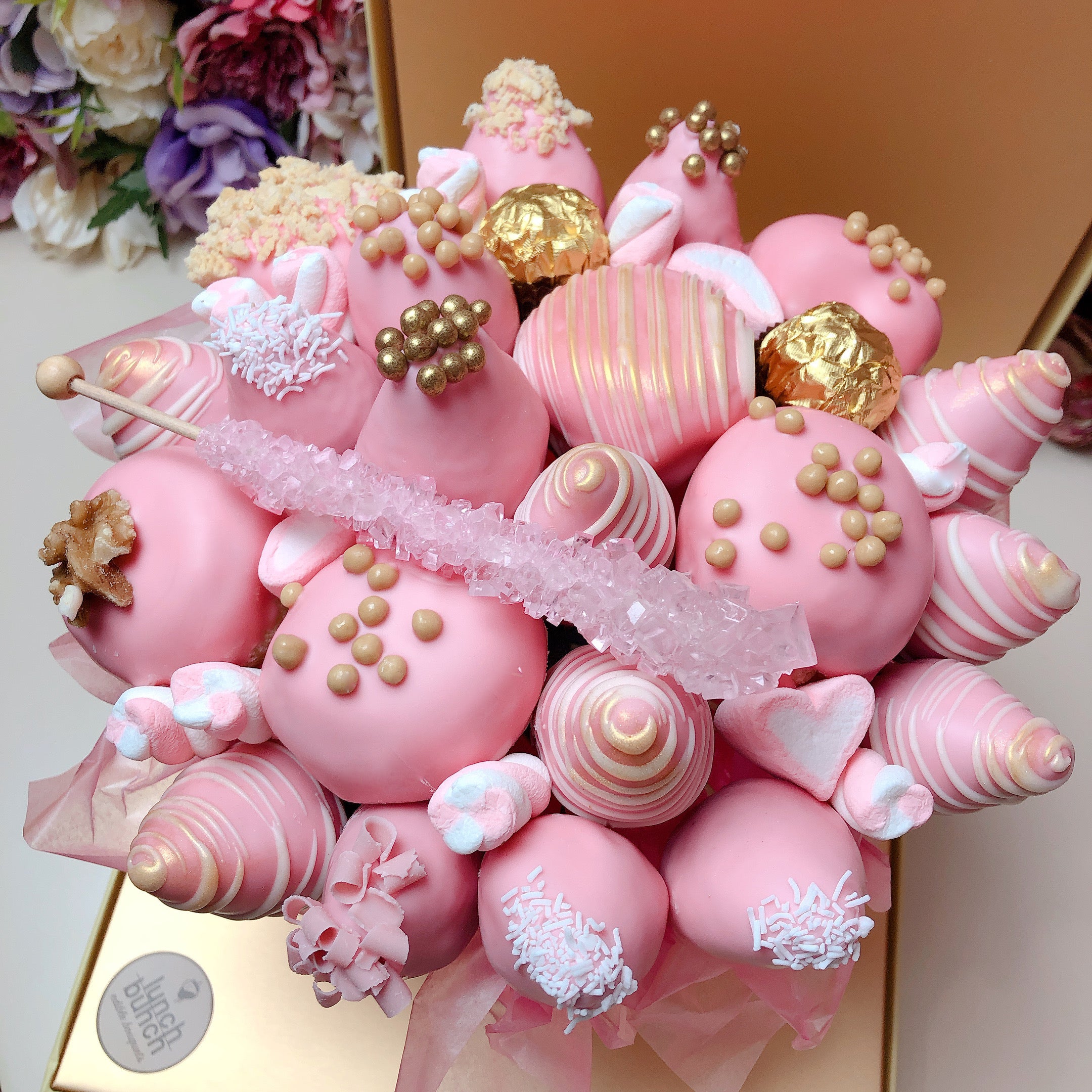 Female Present of chocolate covered strawberries and donut bouquet. Same day delivery gift