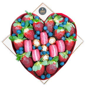 Fresh strawberries and macaroons treat box in love heart shape gift box