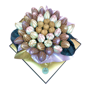 Handcrafted edible bouquet of walnuts and chocolate covered strawberries Bouquet in a transparent gift box