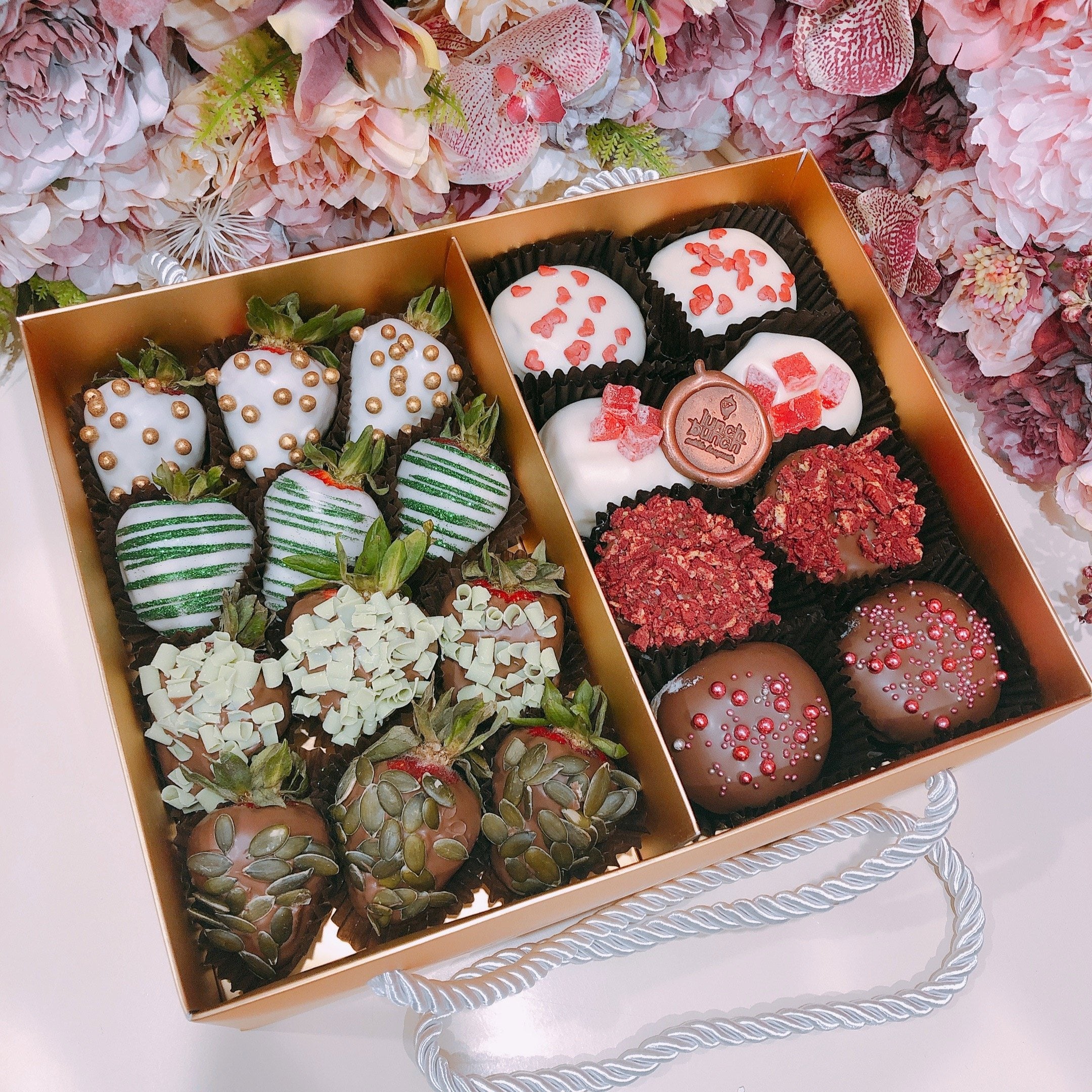 Chocolate strawberries and doughnuts hamper, mini donuts and chocolate covered strawberries in a gift box